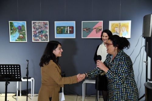 Ardjana Pjetri receiving the award for the best painting from Preng Jakova, Secondary Art School in Shkodra.